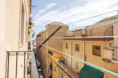 a view of an alley between two buildings at Lodging Apartments Almirall Beach 42 in Barcelona