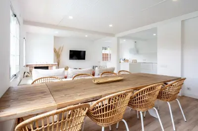 a white room with a bed and a window at Hauzify I Casa Montjuïc in Sant Cebrià de Vallalta