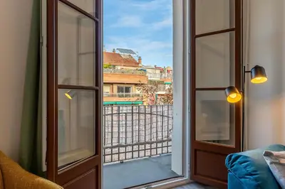 a window with a view of a city at 4182 - AB Poble Sec - Plaza España X in Barcelona