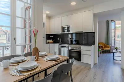 a kitchen with a table with chairs and a dining room at 4182 - AB Poble Sec - Plaza España X in Barcelona