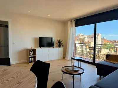 a living room with a couch and a tv at Stay U-nique Apartments at Albigesos in Barcelona