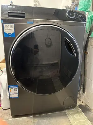 a washing machine sitting on the floor with its door open at Can cruspinera WITH 6BEEDROOM in Tiana