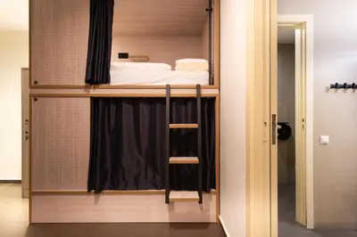 a bedroom with a bunk bed in a room at GG Hostel in Barcelona