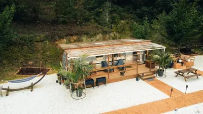 an overhead view of a house with a roof at Caravana Airstream Vintage del 67 en Orrius, Barcelona in Orrius