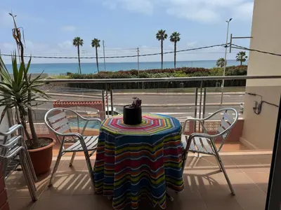 a table and chairs on a balcony with a view of the ocean at Apartamento Pineda de Mar con Vistas al Mar in Pineda de Mar