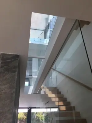 a staircase in a building with a glass wall at Casa de lujo en Gavá mar in Gavà