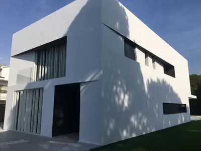 a white building with a lot of windows at Casa de lujo en Gavá mar in Gavà