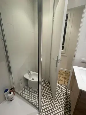 a bathroom with a shower with a toilet and a sink at The Perfect Nomad's Home - Barcelona in Barcelona