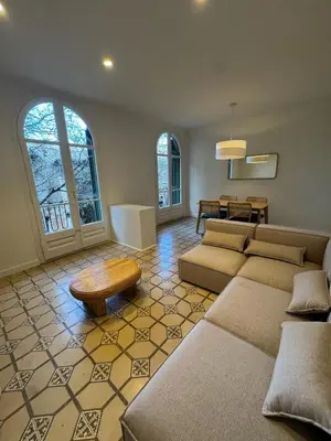a living room with two couches and a table at The Perfect Nomad's Home - Barcelona in Barcelona