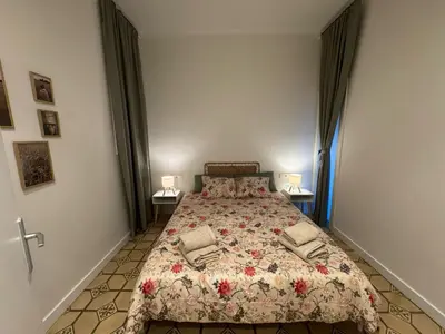 a bedroom with a bed and two lamps on two tables at The Perfect Nomad's Home - Barcelona in Barcelona