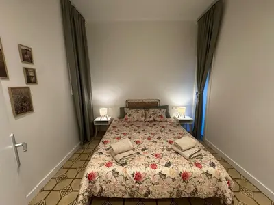 a bedroom with a bed and two lamps on two tables at The Perfect Nomad's Home - Barcelona in Barcelona