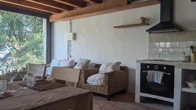 a living room with a couch and a fireplace at La Coma in gualba de Dalt