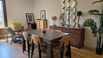 a dining room with a table and chairs at Opening Doors Summer Chic in Barcelona