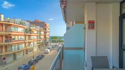 a view of a city street from a balcony at Vivalidays Margarita - Pineda de Mar in Pineda de Mar