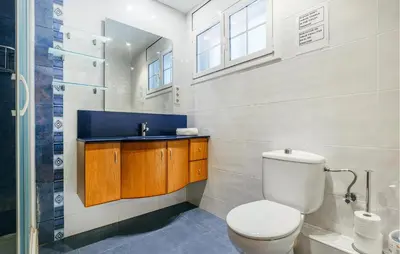 a bathroom with a toilet and a sink at Lovely Home In Segur De Calafell in Segur de Calafell
