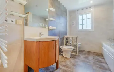 a bathroom with a sink and a toilet at Lovely Home In Segur De Calafell in Segur de Calafell