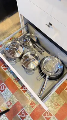 a row of plates and utensils on a shelf in a kitchen at Two bedrooms bright apartment center Barcelona in Barcelona