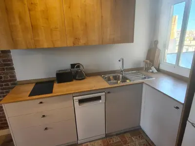a kitchen with a sink and a counter top at Two bedrooms bright apartment center Barcelona in Barcelona