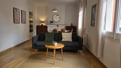 a living room with a couch and a table at Opening Doors Sant Pau II Centric AACC in Barcelona
