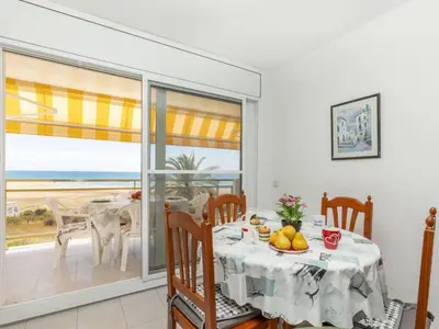 a dining room with a table and a view of the ocean at Apartment Bahia by Interhome in Cunit