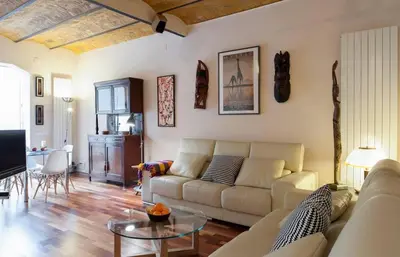 a living room with a couch and a table at Barcelona - Provença in Barcelona