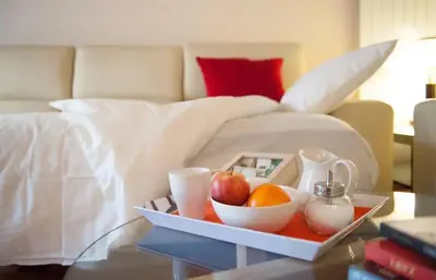 a tray of fruit on a table in a bedroom at Barcelona - Provença in Barcelona