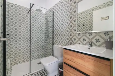 a bathroom with a toilet and a sink at INT Studio totalmente equipado, 15' de BCN centro 8' playa in Sant Adria de Besos
