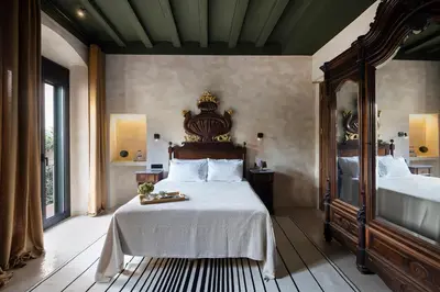 a hotel room with a bed and a bathroom at Hotel Vella Nit in Canet de Mar
