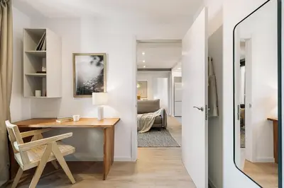 a patio with a couch and a table and chairs at Agropoli - 2 bedrooms and terrace in Ciutat Vella in Barcelona