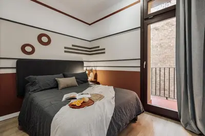a living room with green and white walls at Cinar - 2 bedrooms and balcony in Sant Antoni in Barcelona