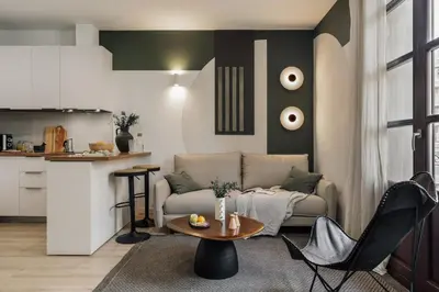 a kitchen and living room with a table and chairs at Cinar - 2 bedrooms and balcony in Sant Antoni in Barcelona
