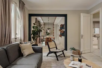 a living room with a couch and a table at Cember - 3 bedrooms and patio in Sant Gervasi in Barcelona