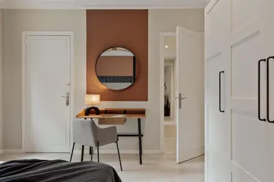 a bedroom with a bed with a blue tiled wall at Cember - 3 bedrooms and patio in Sant Gervasi in Barcelona