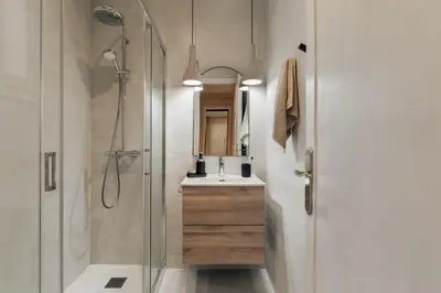 a bathroom with a shower and a sink at Cember - 3 bedrooms and patio in Sant Gervasi in Barcelona