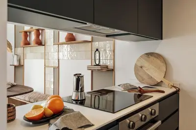 a kitchen with a table with a bowl of fruit on it at Orosi - 2 bedrooms and balcony in Poble Sec in Barcelona