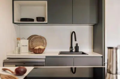 a kitchen with a white door with a bag on it at Orosi - 2 bedrooms and balcony in Poble Sec in Barcelona