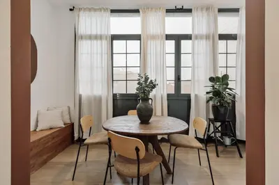 a bedroom with a large bed and a large window at Reis - 3 bedrooms and balcony in Vila de Gràcia in Barcelona