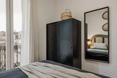 a dining room with a table and chairs at Reis - 3 bedrooms and balcony in Vila de Gràcia in Barcelona