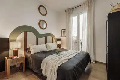 a living room with a couch and a table at Reis - 3 bedrooms and balcony in Vila de Gràcia in Barcelona