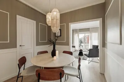 a living room with a couch and a tv at Serralada - 4 bedrooms and terrace in Sant Gervasi in Barcelona