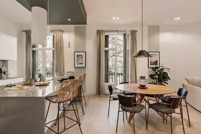 a bedroom with a large bed and a window at Hidiv - 3 bedrooms and terrace in Eixample Dreta in Barcelona