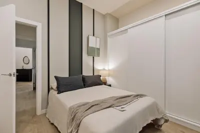 a living room with a couch and a table at Hidiv - 3 bedrooms and terrace in Eixample Dreta in Barcelona