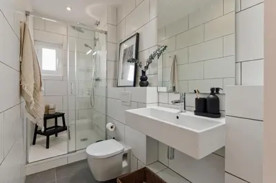 a desk in a room with a chair and a window at Lygos - 2 bedrooms and terrace in Eixample Esquerra in Barcelona