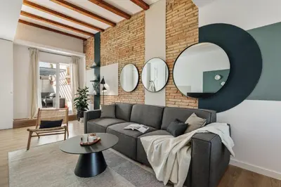 a bathroom with a sink and a mirror at Lygos - 2 bedrooms and terrace in Eixample Esquerra in Barcelona