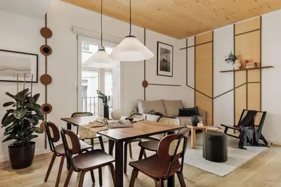 a bedroom with a stone wall and a bed at Arenal - 3 bedrooms and terrace in Sarrià in Barcelona