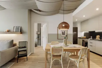 a living room with a couch and a table at Blava - 2 bedrooms in Sant Antoni in Barcelona