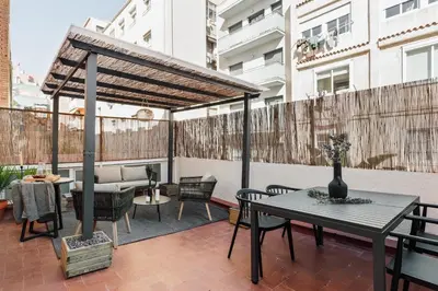 a patio with a gazebo and a table and chairs at Llaberia - 2 bedrooms in Sant Gervasy in Barcelona