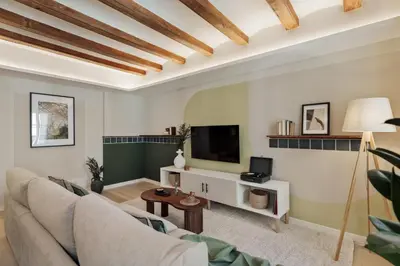 a living room with a large couch and a tv at Izmit - 2 bedrooms and balcony in Sant Pere in Barcelona