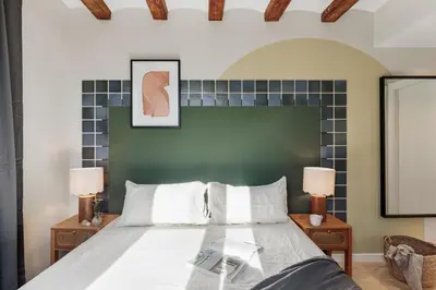 a living room with a couch and a tv at Izmit - 2 bedrooms and balcony in Sant Pere in Barcelona