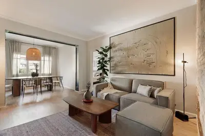 a living room with a couch and a table at Morell - 3 bedroom and office in Eixample Esquerra in Barcelona